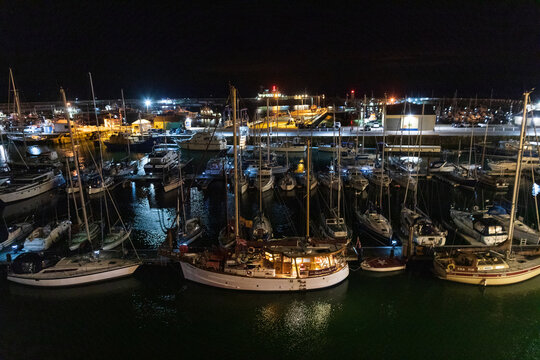 A traditional sail boat moored in Ramsgate harbour during a night ride. 