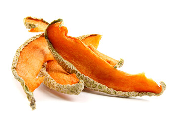 Fototapeta premium Several pieces of dried melon are isolated on a white background.