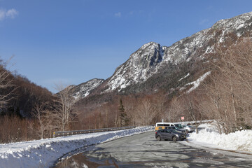 New Hampshire mountains - Cannon and Lafayette, Franconia Notch State Park. Snowy hills and rocks.