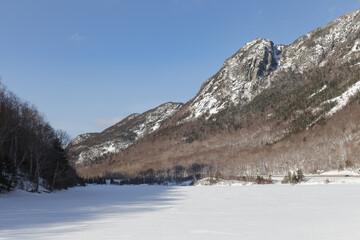 Fototapeta na wymiar New Hampshire mountains - Cannon and Lafayette, Franconia Notch State Park. Snowy hills and rocks.