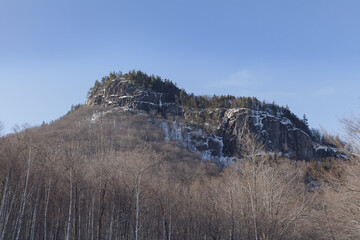 New Hampshire mountains - Cannon and Lafayette, Franconia Notch State Park. Snowy hills and rocks.