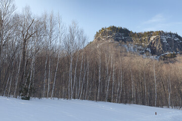 New Hampshire mountains - Cannon and Lafayette, Franconia Notch State Park. Snowy hills and rocks.