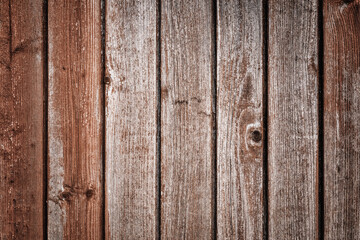Dark brown wooden background with old painted boards