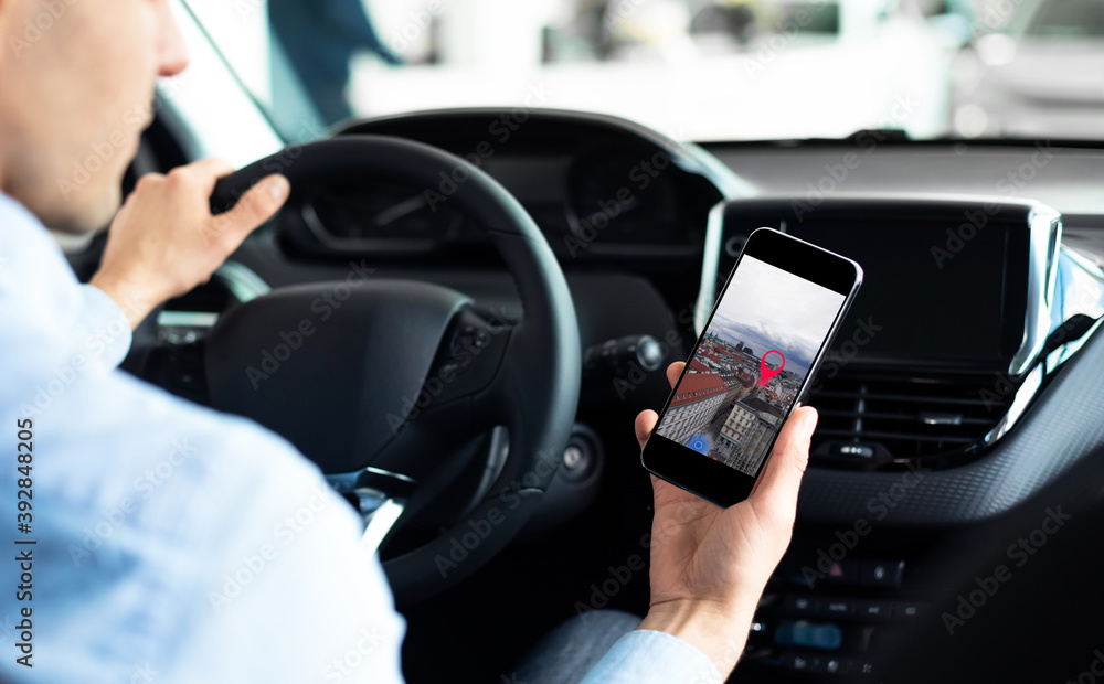 Poster man driving car using phone with mobile navigation application