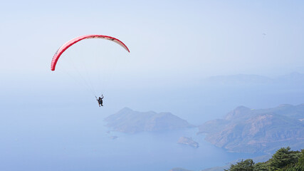 Paragliding in Oludeniz. Parachute in the sky