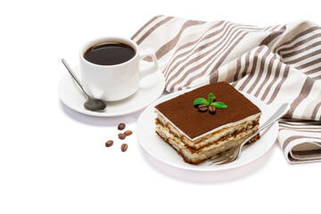 Traditional Italian Tiramisu dessert square portion on ceramic plate and cup of fresh espresso coffee isolated on white