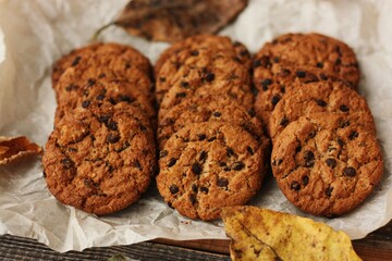 Delicious oatmeal cookies with chocolate on the table