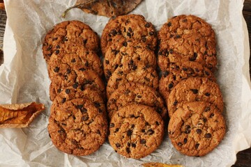 Delicious oatmeal cookies with chocolate on the table