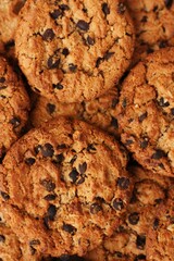 Delicious oatmeal cookies with chocolate on the table