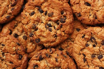 Delicious oatmeal cookies with chocolate on the table