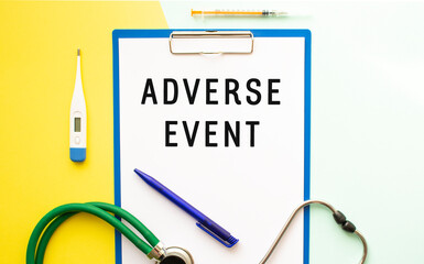 Text ADVERSE EVENT on a letterhead in a medical folder on a colorful background..