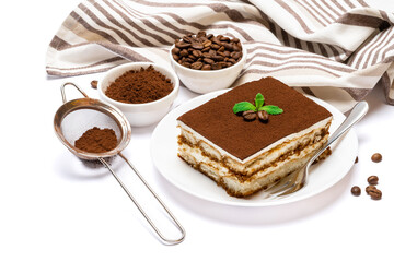 Traditional Italian Tiramisu dessert square portion on ceramic plate and savoiardi cookies isolated on white