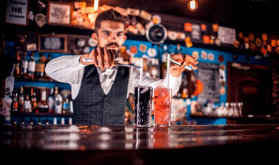 Barman formulates a cocktail in the beerhall