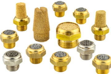 Macro shots of several randomly arranged air silencers covered with brass balls and a metal mesh, isolated on a white background.