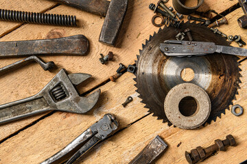 Variety of old vintage household hand tools still life on a wooden background in a DIY and repair concept