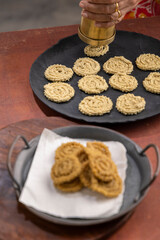 Chakri or Chakli is a spiral shaped savoury snack from India, it is typically made from flours of rice, brown chickpea and black gram.