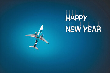 Naklejka na ściany i meble The airplane flies on a dark blue background with the inscription Happy new year.