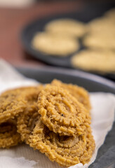 Chakri or Chakli is a spiral shaped savoury snack from India, it is typically made from flours of rice, brown chickpea and black gram.