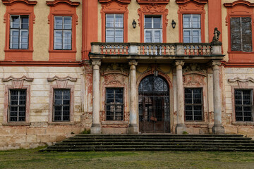 Old abandoned ruined baroque Libechov castle with balcony in sunny day, Romantic chateau was heavily damaged after affected by flooding in 2002, Central Bohemia, Czech republic