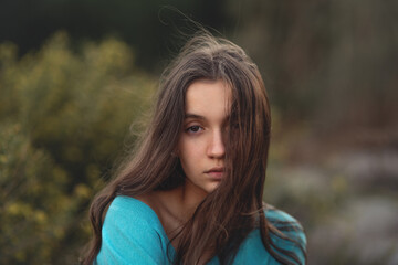 Naklejka premium Young girl hair blowing in the wind