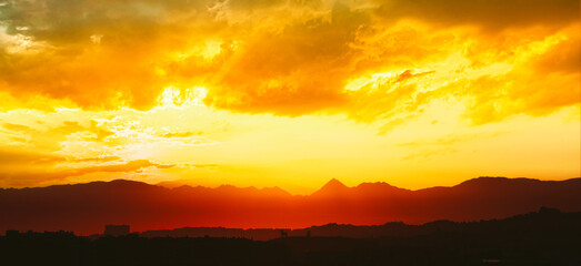 Spain, Andalusia. Amazing Sunset Sunrise With Sun Over Dark Mountain Ground. Bull Silhouette.