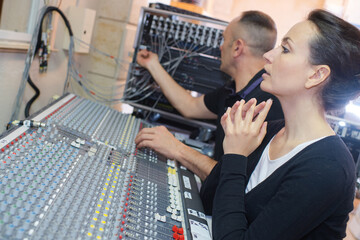 attractive happy radio host interviewing a guest
