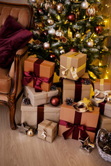 Fototapeta na wymiar close up of wrapped gift boxes under Christmas tree