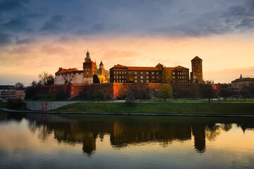 Fototapeta premium historic church and castle on the river bank in the morning light