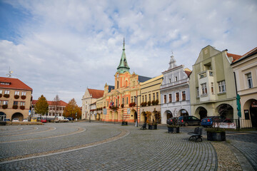 Fototapeta na wymiar Baroque town hall with clock tower at main Peace square of historic medieval royal town Melnik, colorful renaissance houses in sunny autumn day, Central Bohemia, Czech republic