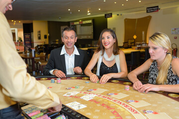 Fototapeta premium upper class friends gambling in a casino