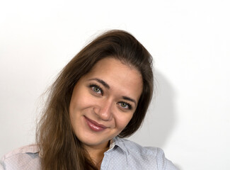 Photo of a young beautiful girl face close-up, smiling