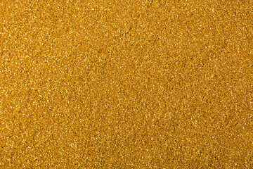 Shiny glitter texture in gold colour for expensive project work.