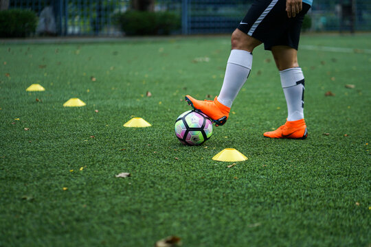 Bangkok / Thailand - June 2018 : Football player training on artificial grass field. Wearing Nike Mercurial Superfly VI, the famous football boots for speedy player like Cristiano Ronaldo and Neymar. 