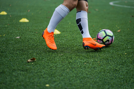 Bangkok / Thailand - June 2018 : Football player training on artificial grass field. Wearing Nike Mercurial Superfly VI, the famous football boots for speedy player like Cristiano Ronaldo and Neymar. 