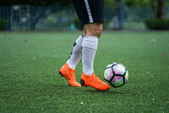 Bangkok / Thailand - June 2018 : Football player training on artificial grass field. Wearing Nike Mercurial Superfly VI, the famous football boots for speedy player like Cristiano Ronaldo and Neymar. 