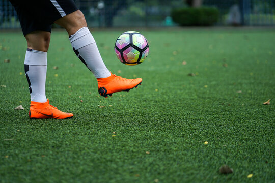 Bangkok / Thailand - June 2018 : Football player training on artificial grass field. Wearing Nike Mercurial Superfly VI, the famous football boots for speedy player like Cristiano Ronaldo and Neymar. 