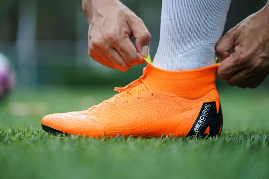 Bangkok / Thailand - June 2018 : Football player training on artificial grass field. Wearing Nike Mercurial Superfly VI, the famous football boots for speedy player like Cristiano Ronaldo and Neymar. 