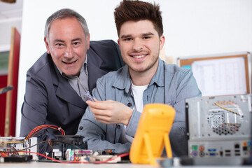 portrait of apprentice and mentor with technology
