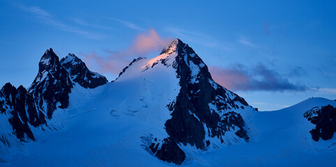 alpenglow at blue hour on Petit Mont Colon in swiss alps seen from Cabbane des Vignettes of swiss...