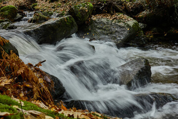 Small waterfalls in the bed of the Sestil de Maíllo stream. Autumn in the Sierra de Guadarrama National Park. Madrid's community. Spain