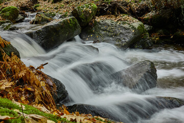 Small waterfalls in the bed of the Sestil de Maíllo stream. Autumn in the Sierra de Guadarrama National Park. Madrid's community. Spain