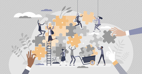 Teamwork puzzle as effective team collaboration process tiny person concept - obrazy, fototapety, plakaty