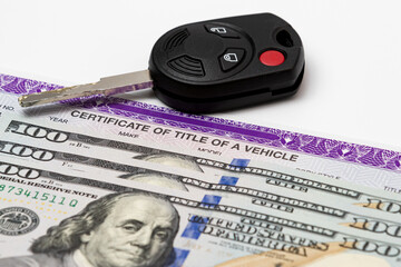 Car key, vehicle title and 100 dollar bills cash. Concept of automobile purchase, ownership, state...