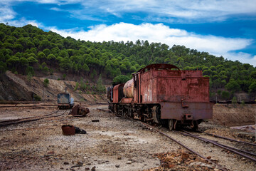 abandoned locomotive and train tracks