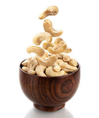 Falling cashew nuts isolated on white background