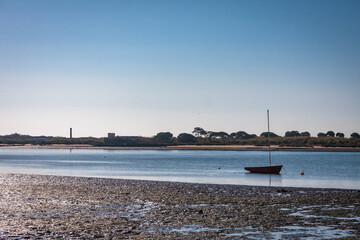 boat under the sun in a marsh in Andalusia