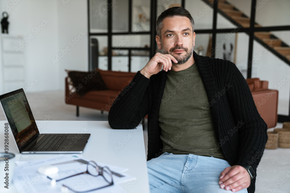 Canvas Prints Handsome confident young businessman working