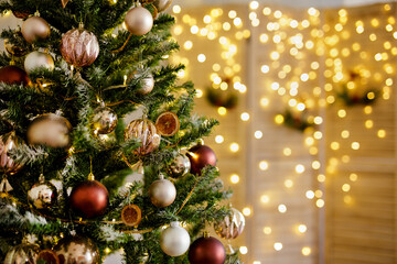 close up of decorated christmas tree and folding screen with led lights