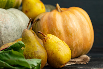 Pumpkins and pears on wooden table close-up