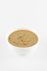 Mung beans porridge (bubur kacang hijau) is a Malaysian traditional dish usually eat as starter or desert. Made from mung beans, coconut milk & palm sugar. Isolated over white background.